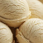 Close-up of multiple scoops of gluten-free vanilla ice cream with crystal texture